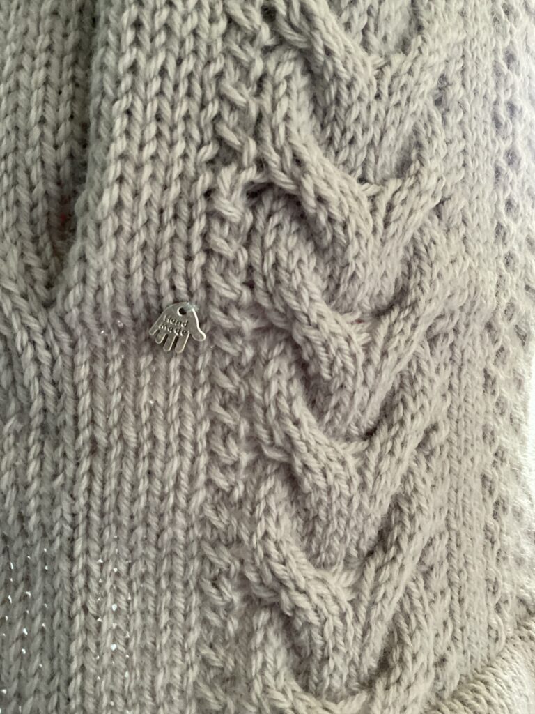 Image of slit pockets on biker style coatigan and some Aran stitches