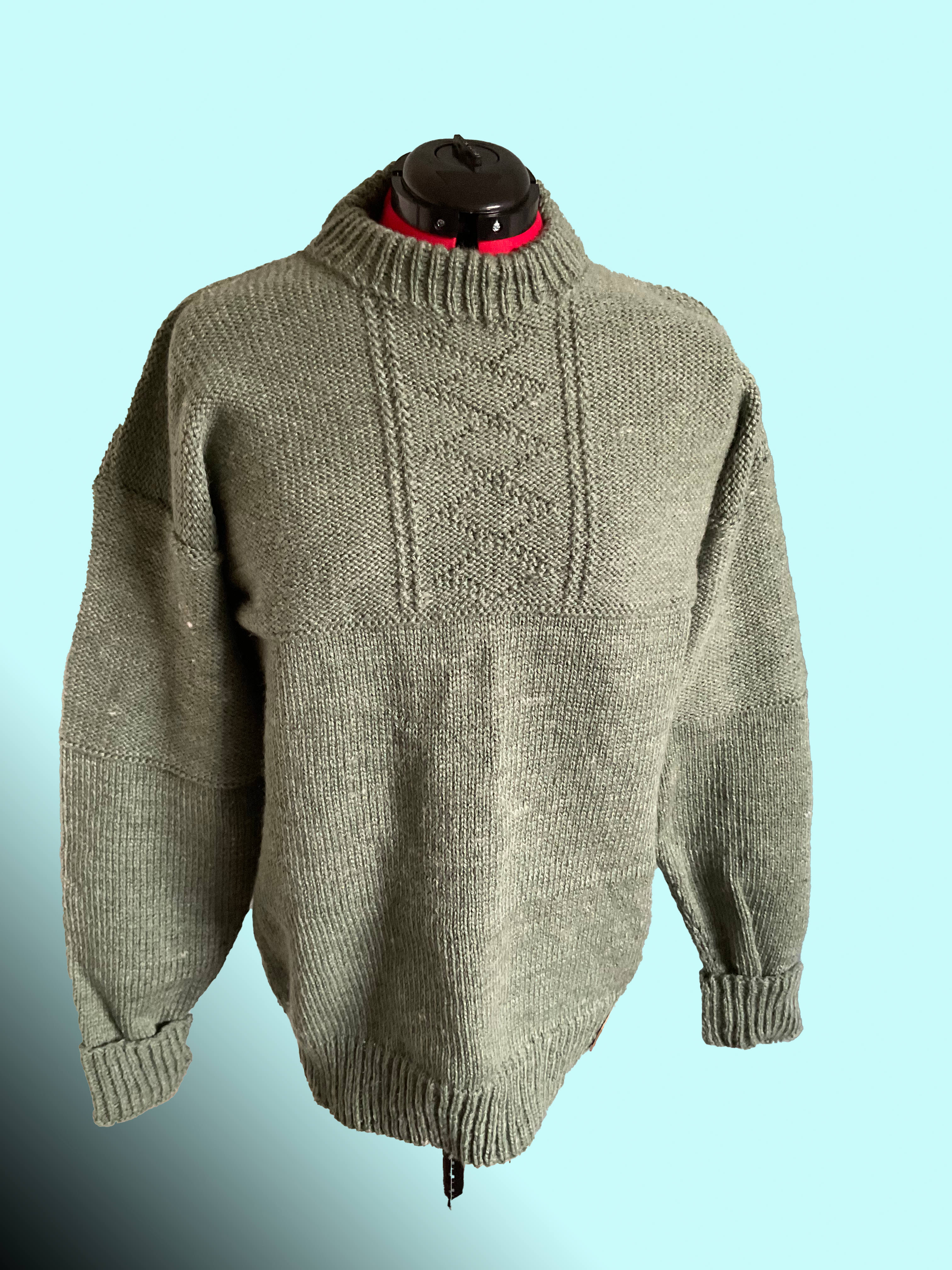 Mans knitted sweater, half stocking stitch, half reverse stocking stitch and diamond pattern.