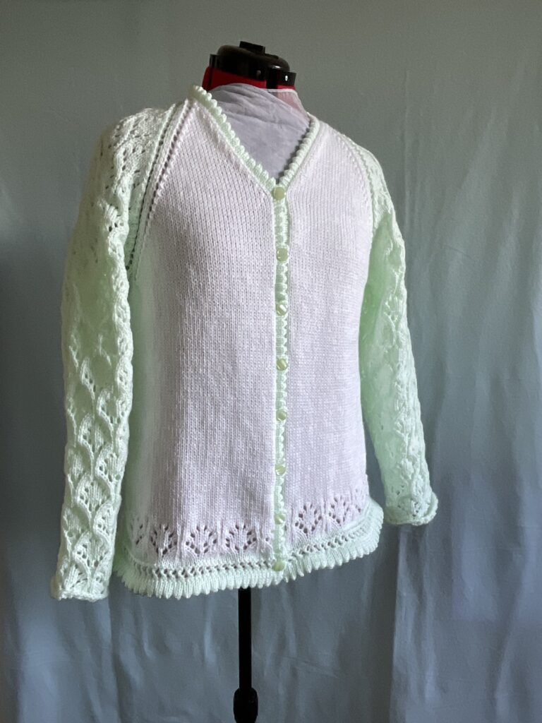 Ladies knitted cardigan with lace sleeves in contrast colour, picot hem and boarder