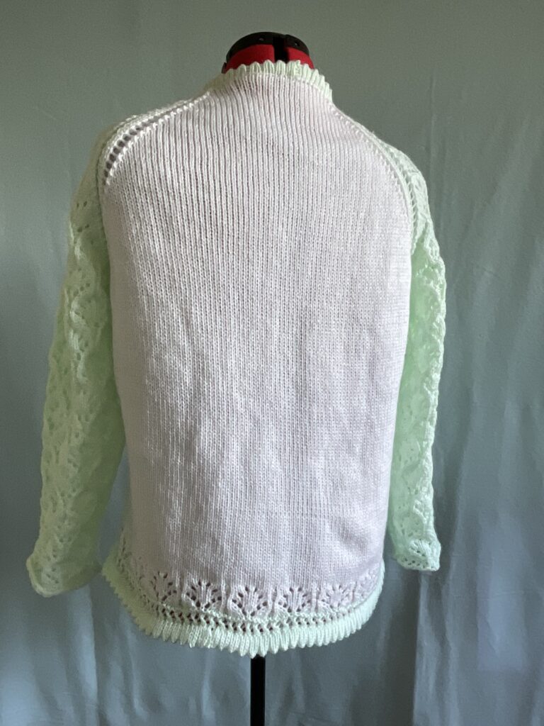 Back view of ladies knitted cardigan with lace sleeves 