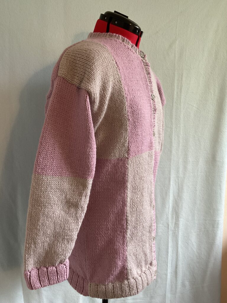 Side view of ladies two-tone long-line knitted cardigan